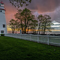An image of the Marblehead Lighthouse during sunrise.